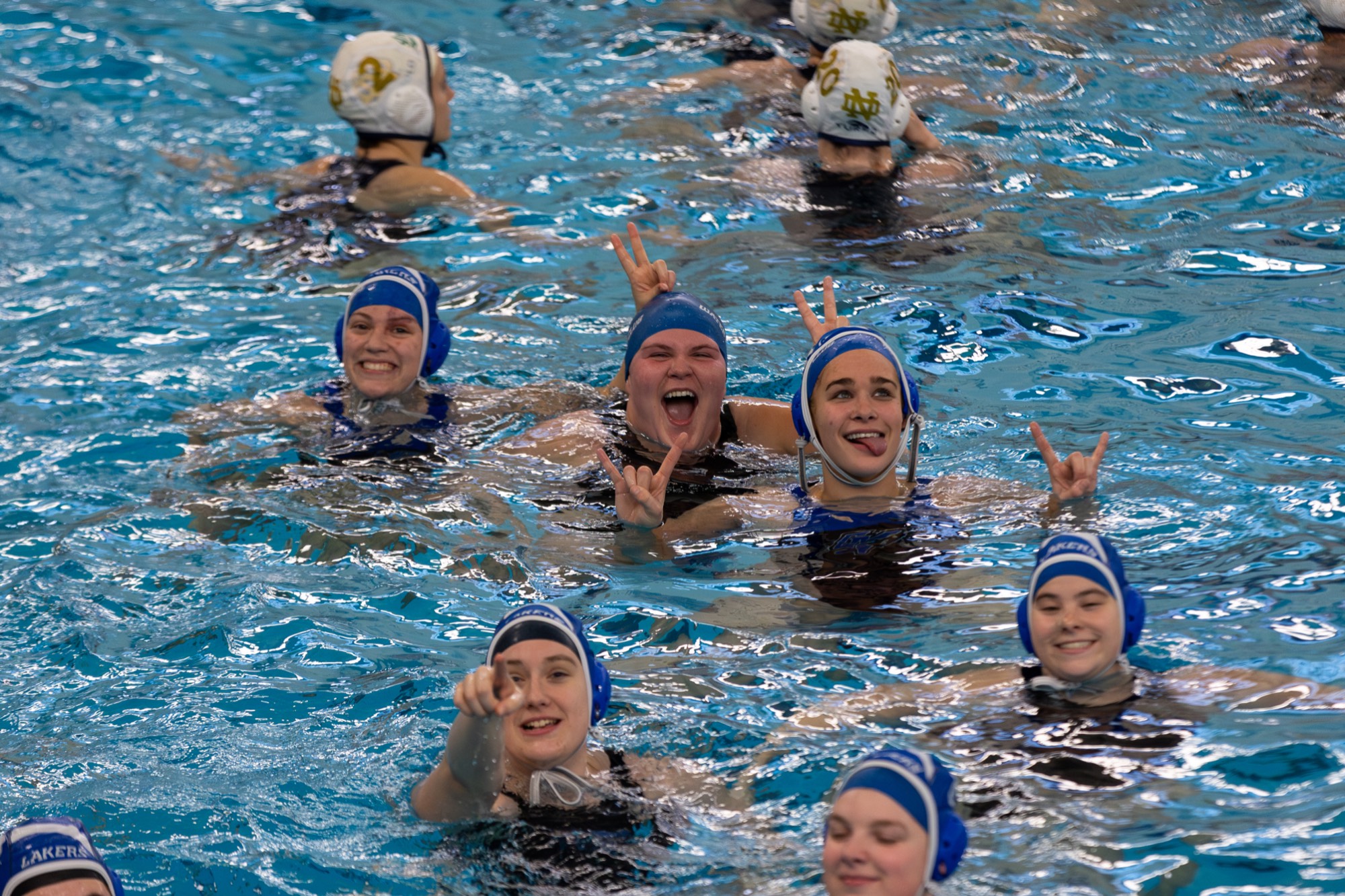 girls having fun in the pool during warmups